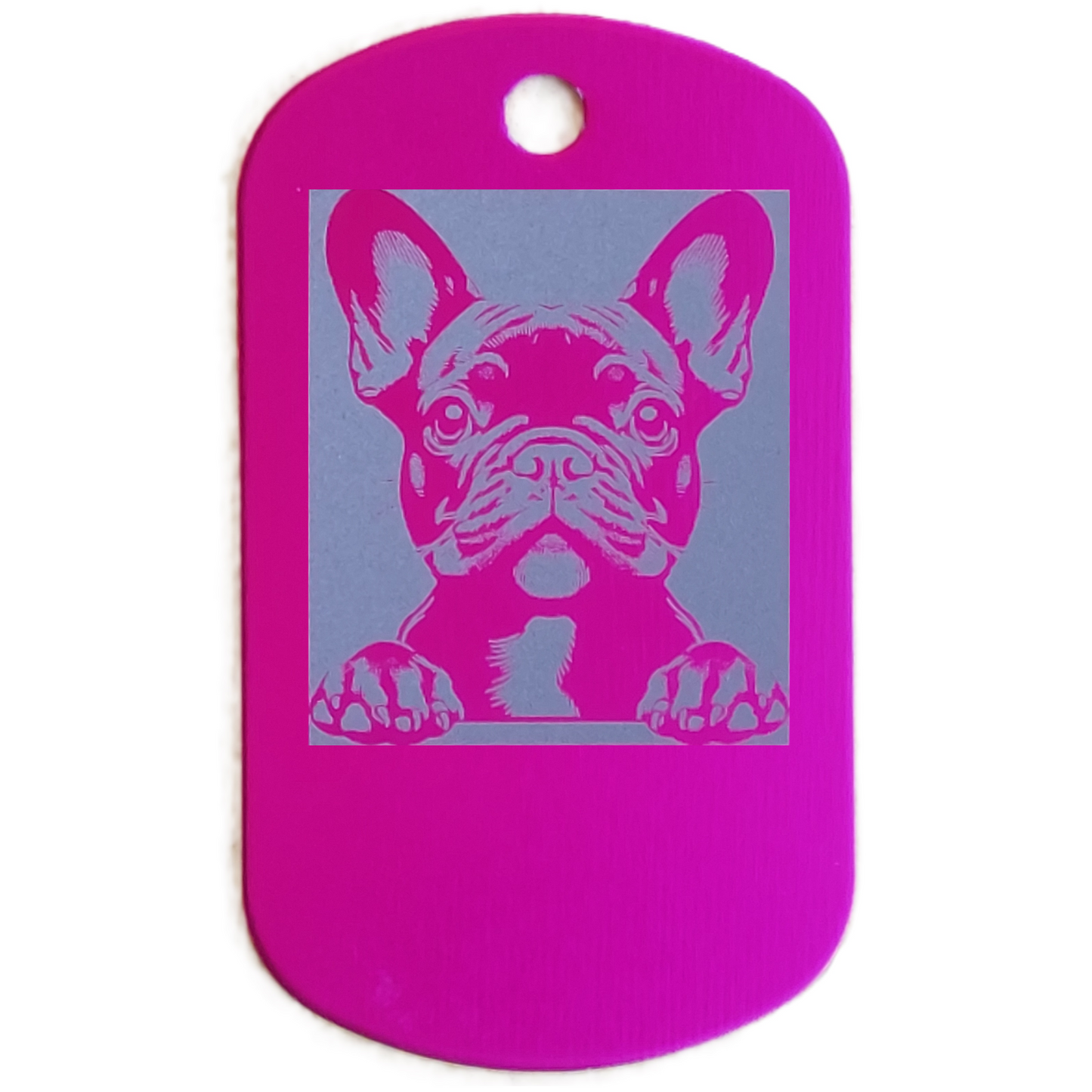 Pink dog id tag with a dog's face design on a white background