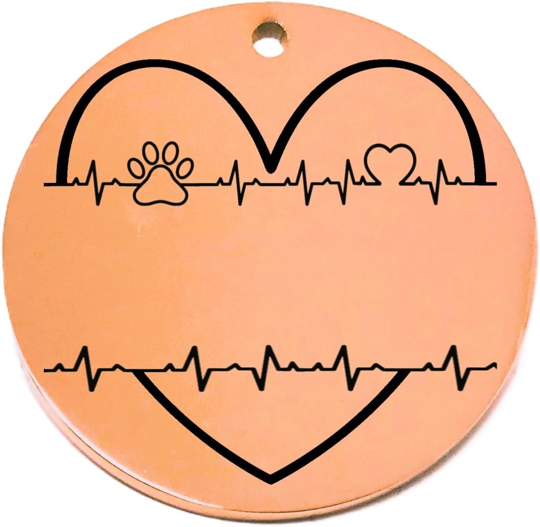 Round rose gold pet tag with black heart and paw print design on a white background