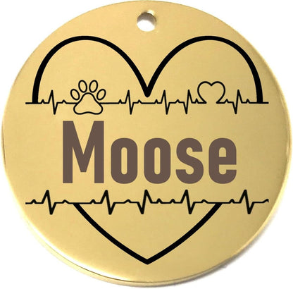 Gold pet tag with 'Moose' engraved, heart design, and paw print on a white background