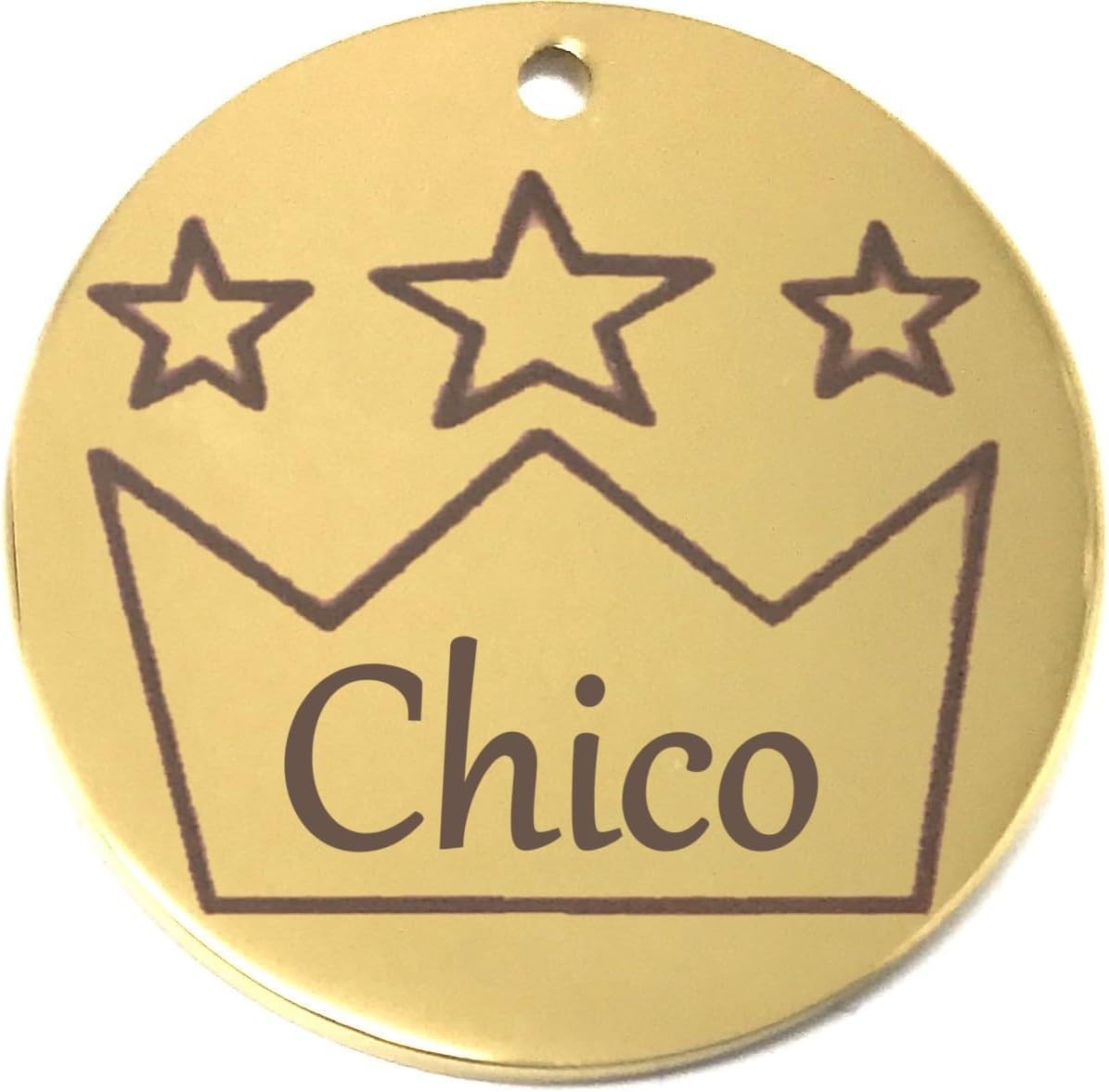 Gold pet name tag with star design and 'Chico' text on the crown