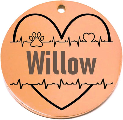 Round rose gold pet tag with 'Willow' and heart designs on a white background