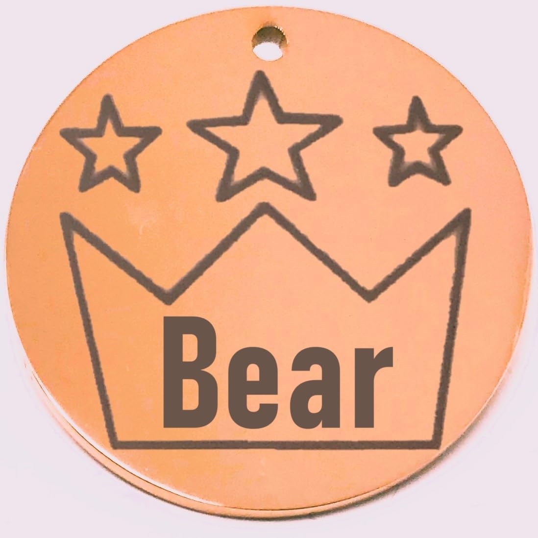 Round rose red cat id tag with star design and 'Bear' text on a white background