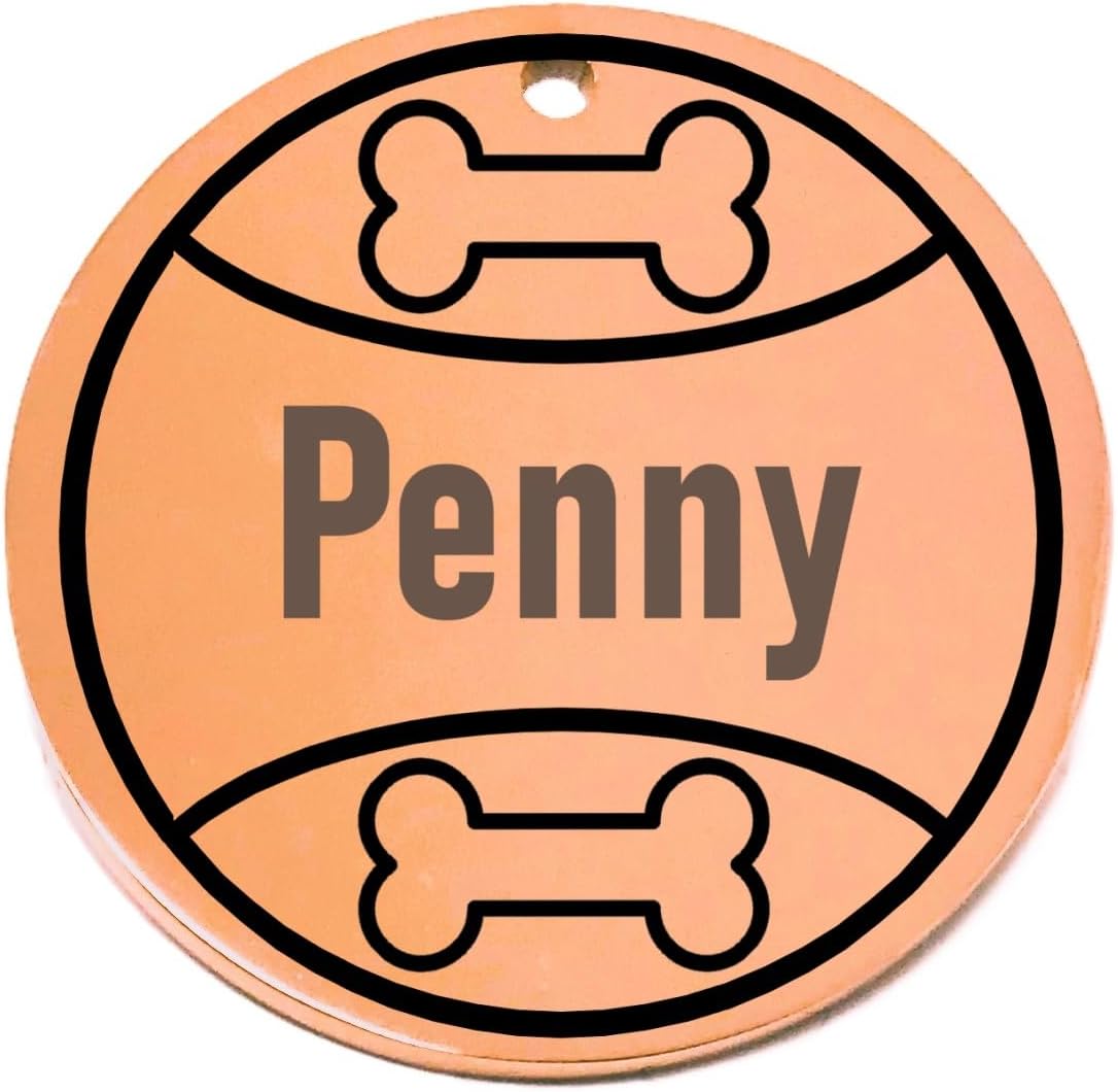 Personalized round pet id tag with 'Penny' engraved, surrounded by bone designs on a white background
