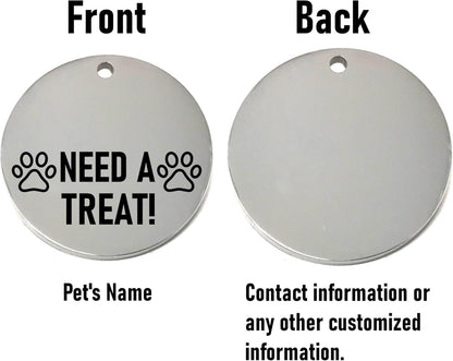 Two round silver dog tags, one with 'Need a Treat!' text and paw prints, the other for customization.